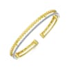 This 14k two tone cuff bangle features one half carats of diamonds. - Image 2 of 0
