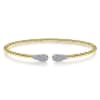14k yellow gold cable cuff bracelet features two diamond sections. - Image 1 of 0