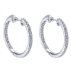 14k white gold mixes with round brilliant diamonds to create this contemporary take on the classic diamond hoop earring! - Image 1 of 0