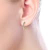 This pair of 14k yellow gold diamond hoop earrings features 0.11 carats of diamond shine. - Image 2 of 0