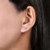 This pair of 14k white gold diamond heart stud earrings feature 0.12 carats. - Image 3 of 0