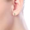 This 14k yellow gold pair of diamond stud earrings feature a rectangle shape. - Image 4 of 0