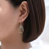 These 14k yellow gold triple loop earrings feature delicate diamond accents. - Image 3 of 0