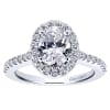 Round brilliant diamonds climb their way up this white gold or platinum band to form a diamond halo surrounding an oval cut diamond of your choice in this diamond oval halo engagement ring! - Image 1 of 0