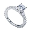 An 18k white gold eternity engagement ring with contemporary and modern styling, shining with nearly 1 full carat in round brilliant diamonds. - Image 5 of 0