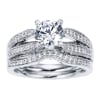 Double bands in white gold or platinum join at the center to cradle a round center diamond of your choice in this vintage style split shank engagement ring, featuring round brilliant diamonds. - Image 5 of 0