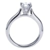 Simplicity at its finest, this smooth band thoughtfully cradles a round center diamond in a sturdy 4 prong setting in this solitaire engagement ring. - Image 3 of 0