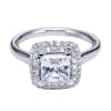 A double row of diamonds encapsulates a princess cut center diamond in this variation of a contemporary halo engagement ring. - Image 2 of 0