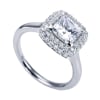 A double row of diamonds encapsulates a princess cut center diamond in this variation of a contemporary halo engagement ring. - Image 4 of 0