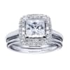 A double row of diamonds encapsulates a princess cut center diamond in this variation of a contemporary halo engagement ring. - Image 5 of 0