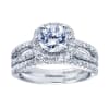 Double the bands for double the pleasure in this white gold or platinum contemporary halo engagement ring with round diamonds. - Image 5 of 0