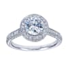 Your choice of platinum or white gold in this vintage style halo engagement ring with 3/4 carats of round brilliant diamonds and a round center diamond of your choice. - Image 1 of 0