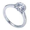 A round brilliant halo contrasts perfectly with the sleek white gold band in this contemporary halo engagement ring available in platinum or white gold. - Image 4 of 0