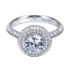 This white gold engagement ring has double rows of round diamonds to accent a round center diamond in this contemporary halo engagement ring. - Image 2 of 0
