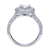 This white gold engagement ring has double rows of round diamonds to accent a round center diamond in this contemporary halo engagement ring. - Image 3 of 0