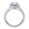 An emerald cut center diamond gleams magnificently encircled in round brilliant diamonds set in a vintage halo engagement ring designed by Gabriel & Co. - Image 3 of 0