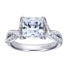 A princess cut center diamond sits in the middle of criss cross split shank bands, all covered in round brilliant diamonds in this platinum criss cross engagement ring. - Image 1 of 0