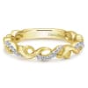 This 14k yellow gold ring showcases a modern sensibility with diamonds and a unique style. - Image 1 of 0