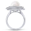 This 14k white gold diamond ring features a pearl swimming in the center of a swirling diamond halo. - Image 2 of 0