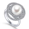This 14k white gold diamond ring features a pearl swimming in the center of a swirling diamond halo. - Image 3 of 0