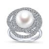 This 14k white gold diamond ring features a pearl swimming in the center of a swirling diamond halo. - Image 4 of 0