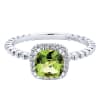 This delicate dandy features 14k white gold leading up to a peridot with a round diamond halo in this 14k white gold diamond gemstone ring. - Image 1 of 0