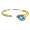 This swiss blue topaz ring features an open design with gorgeous diamonds laid over 14k yellow gold. - Image 1 of 0