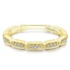 This channel set 14k yellow gold diamond stackable ring features round brilliant diamonds. - Image 1 of 0