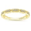 This channel set 14k yellow gold diamond stackable ring features round brilliant diamonds. - Image 4 of 0