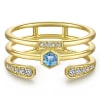 This 14k yellow gold ring is stacked with blue topaz and diamonds. - Image 1 of 0