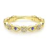 This 14k yellow gold sapphire and diamond ring is a stackable style. - Image 1 of 0