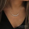 This dreamy diamond bar necklace in 18k white gold features different sized round brilliant diamonds set into a bar. - Image 3 of 0