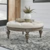 Americana Farmhouse Round Cocktail Ottoman in Taupe Finish by Liberty Furniture - 615-OT1080 - Image 1 of 0