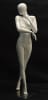 Glossy white female egghead mannequin in a walking pose standing on a square metal base with an ankle rod support. - Image 1 of 0