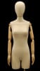 Pinnable female 3/4 dress form in tan linen with posable wood-look arms and a brushed metal offset floor base. - Image 1 of 0