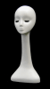 Female fiberglass display head with long neck and eyelashes for retail accessory merchandising. - Image 1 of 0
