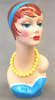 Vintage style hand-painted fiberglass female display head with colorful makeup and an integrated base for retail accessory merchandising. - Image 1 of 0