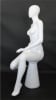 Female egghead mannequin in seated pose. Her legs are crossed with her hands on her lap. - Image 3 of 0