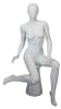 Female egghead mannequin in seated pose. Her legs are crossed with her hands on her lap. - Image 6 of 0
