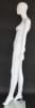 Matte white female egghead mannequin made of fiberglass, poised on a tempered glass base, showcasing retail clothing with an energetic posture. - Image 4 of 0