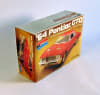 Box art with photo of actual scale model car by Monogram of a red '64 Pontiac GTO on gold background. - Image 3 of 0