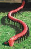 The Valterra Slunky RV Sewer Hose Support, S2000, is a 20-foot collapsible, accordion-style plastic support system that elevates your RV sewer drain hose off the ground. Its sloping design creates a consistent downhill path for waste to drain. - Image 1 of 0