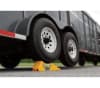 The Trailer Aid tire change ramp, model #21 by Camco, is a device for changing a flat tire on a tandem-axle trailer without a jack. To use it, you drive the good tire onto the ramp, which lifts the flat tire off the ground for easy removal. - Image 2 of 0