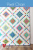 Pixel Chain Quilt Pattern by Cluck Cluck Sew shows a diagonally set quilt with colorful blocks  of small squares in baright colors on a white background. - Image 1 of 0