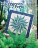 Evergreen Fern Quilt Pattern by Judy Niemeyer shows the cover of the quilt pattern which has a large graphic fern design in teals and blues on a white ground with a dark blue batik border. - Image 1 of 0