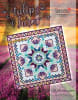 TULIP FARM Quilt Pattern by Judy Niemeyer shows a  blue and white center medallion quilt in bright batiks with intricate foundation piecing and an star  border. - Image 2 of 0