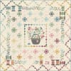 Sewing Basket Quilt Pattern by Laundry Basket Quilts shows a scrappy pieced and appliqued quilt in pastel colors on a variety of light cream background fabrics. - Image 1 of 0