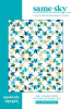 This allover quilt design features stars and diamond shapes in shades of blue, with yellow accents on a white ground. - Image 1 of 0
