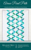 This quilt has a vertical design created by rows of half square triangles and is shown in shades of bright aqua and green on a white background. - Image 1 of 0
