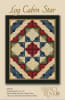 LOG CABIN STAR Quilt Pattern from Nancy Rink Designsshows a quilt with blocks set on-point for a dramatic effect and with a dark floral border. - Image 1 of 0